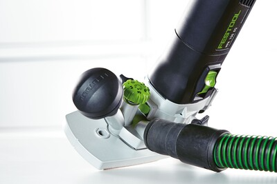 Compact trim router with dust extraction hose and ergonomic controls for precise home improvement woodworking tasks
