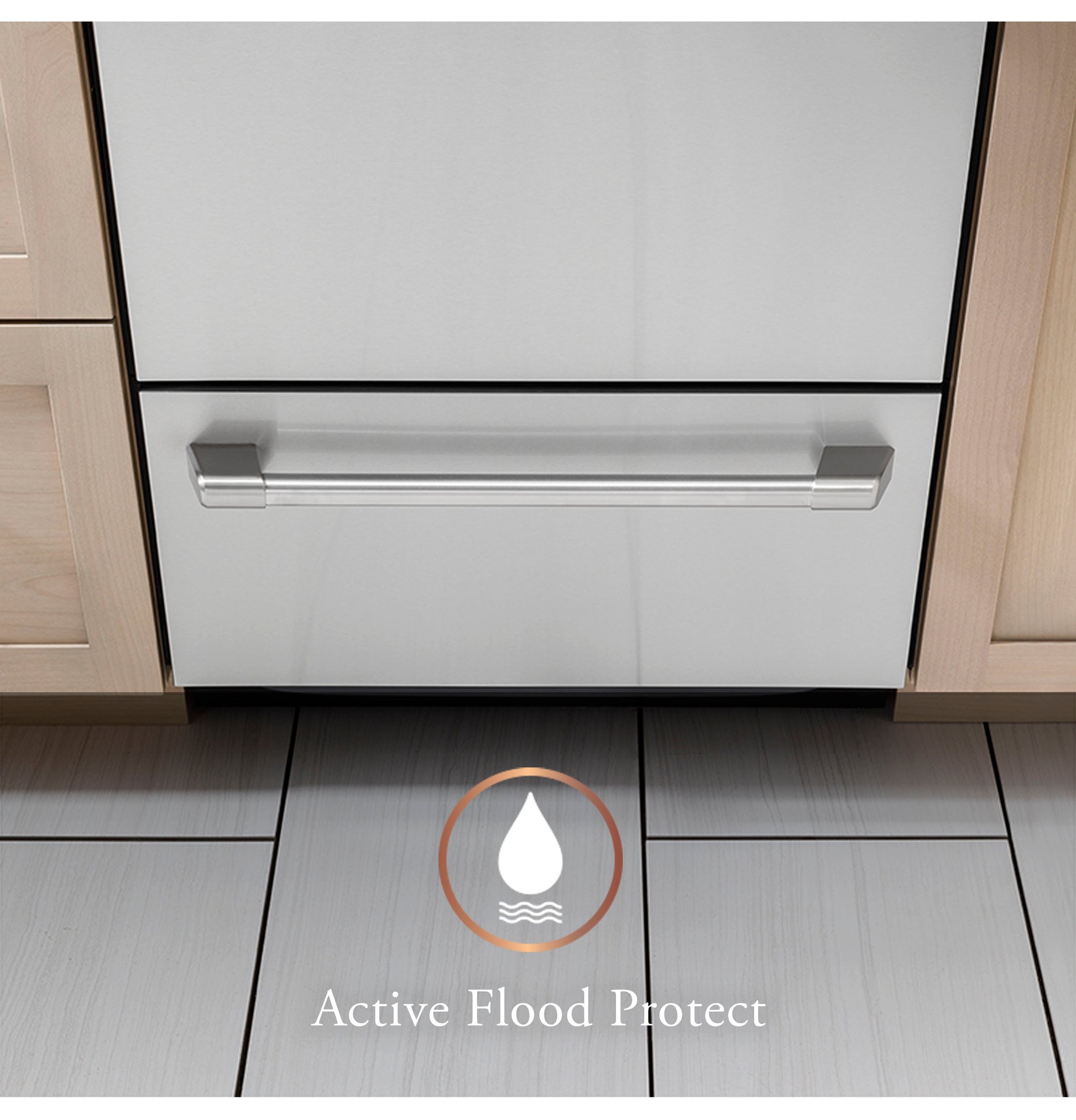 Lower drawer of stainless steel dishwasher with flood protection feature shown on tiled kitchen floor near wood cabinets