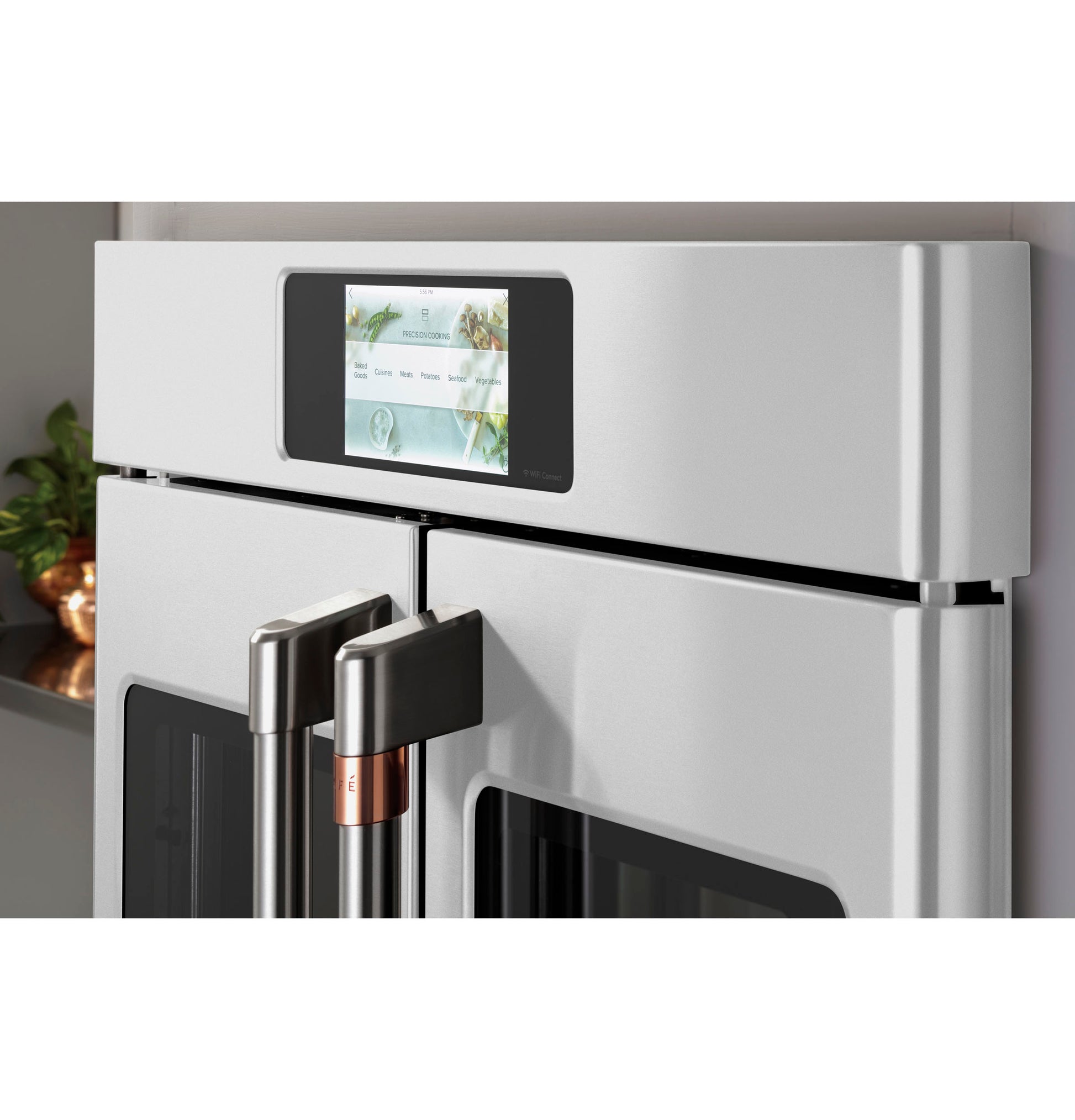 Close-up of stainless steel French-door single wall oven with digital touchscreen control in modern kitchen setting
