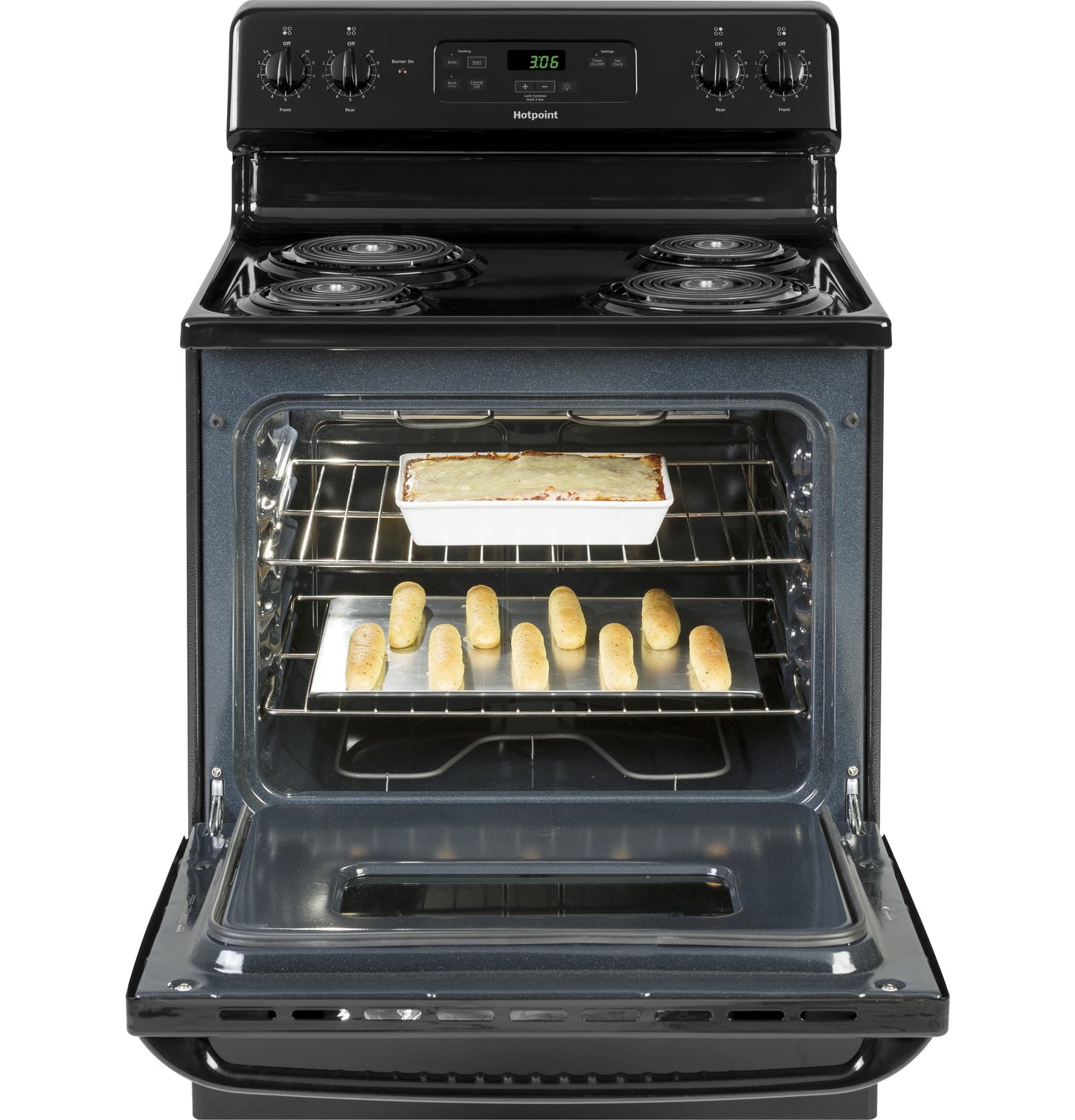 Black free-standing electric range with coil burners and open oven containing baked breadsticks and casserole dish