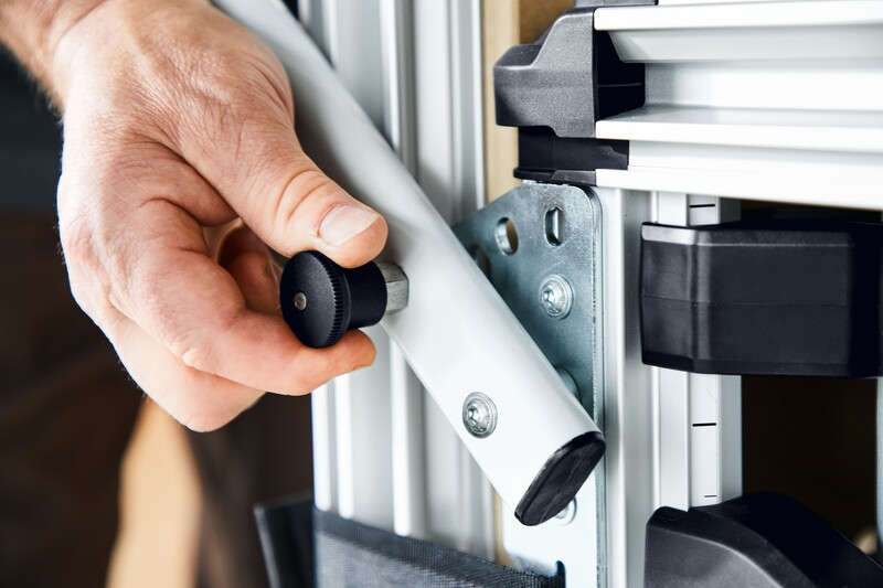 Hand adjusting a knob on an aluminum frame of a mobile workshop cart from Festool Storage & Mobility collection.