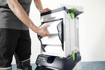 Person installing a Festool dust extractor filter cartridge for woodworking dust collectors and air filtration tools