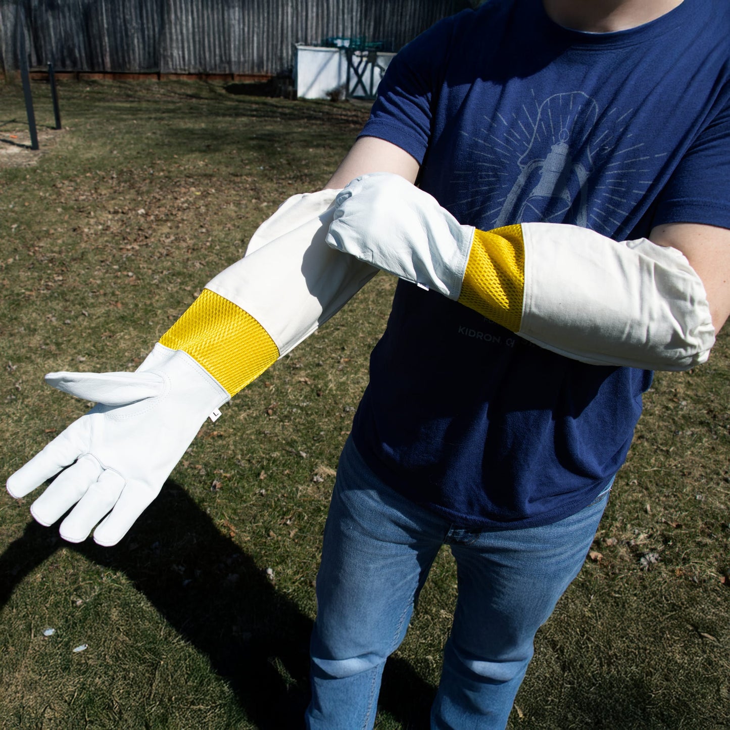 Goatskin gloves with yellow mesh panels and extended cuffs providing protection for beekeeping and home improvement tasks