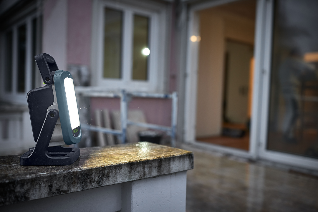 Compact cordless Festool Syslite site light illuminating outdoor workspace for home improvement and work lights collections
