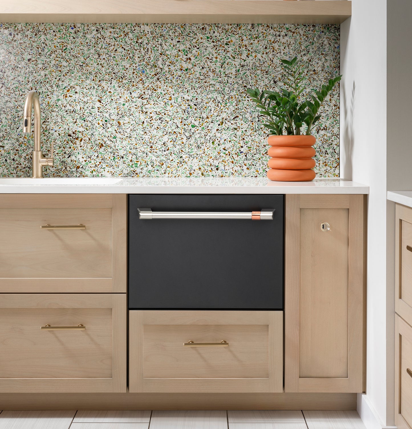 Black smart single drawer dishwasher with stainless steel and copper handle built into light wood cabinetry in Dishwashers collection