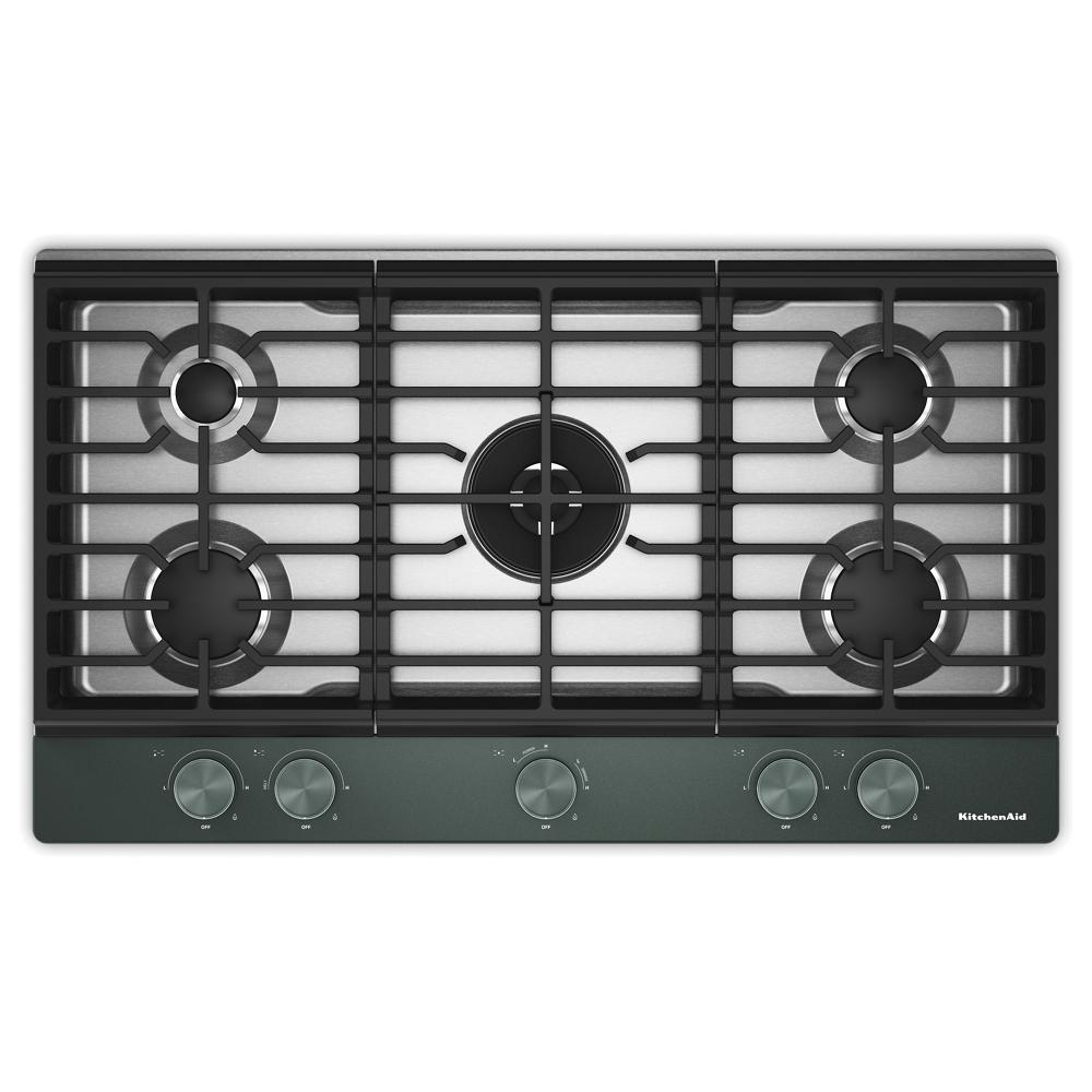 Top view of a KitchenAid gas cooktop with five burners including a central integrated wok grate, featuring backlit control knobs, ideal for kitchen appliances and home improvement.