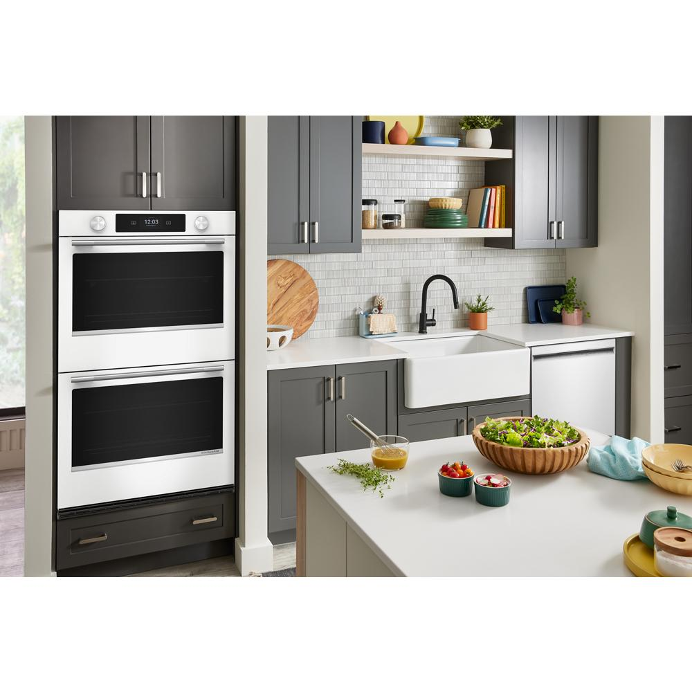 Modern kitchen with gray cabinets and white smart electric double wall oven from Double Wall Ovens collection