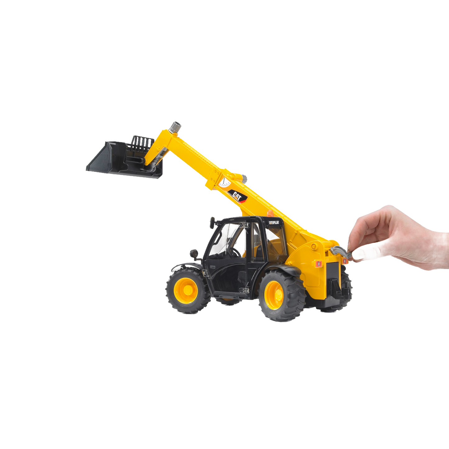 Hand operating yellow Bruder 02142 CAT Telehandler toy with extendable arm and front bucket in toy vehicles collection