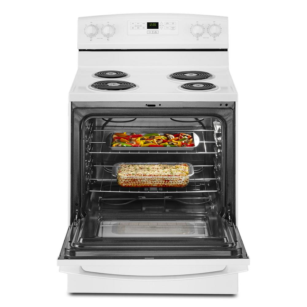 White 30-inch electric range with four coil burners and open oven containing two baked casserole dishes for kitchenware collection