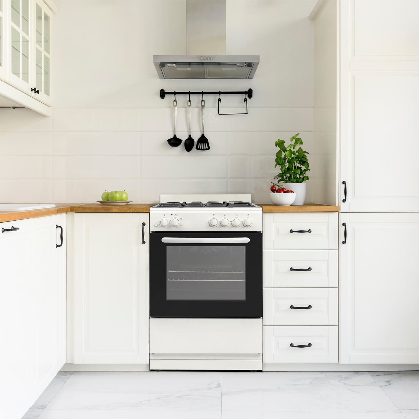 compact white gas range with four burners under stainless steel hood in modern kitchen setting