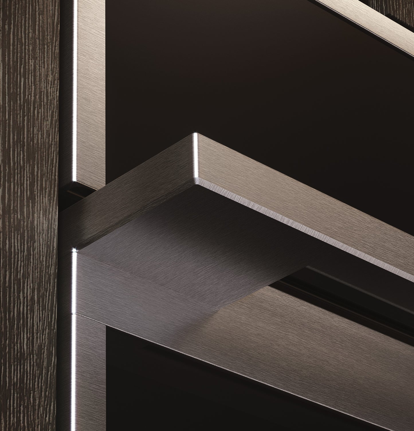 Close-up of brushed stainless steel handle and frame on minimalist five-in-one wall oven in modern kitchen setting