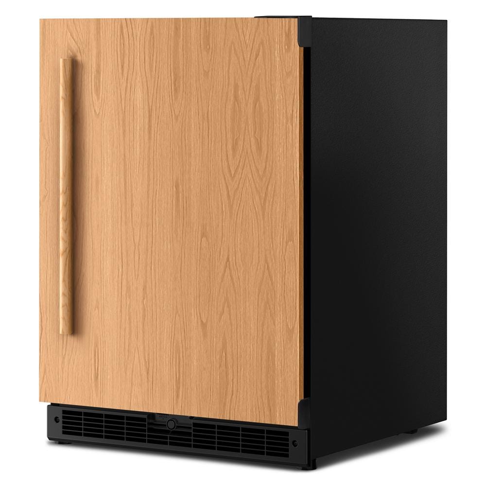 Undercounter refrigerator with wood panel door and black vent grille designed for kitchen and home improvement spaces