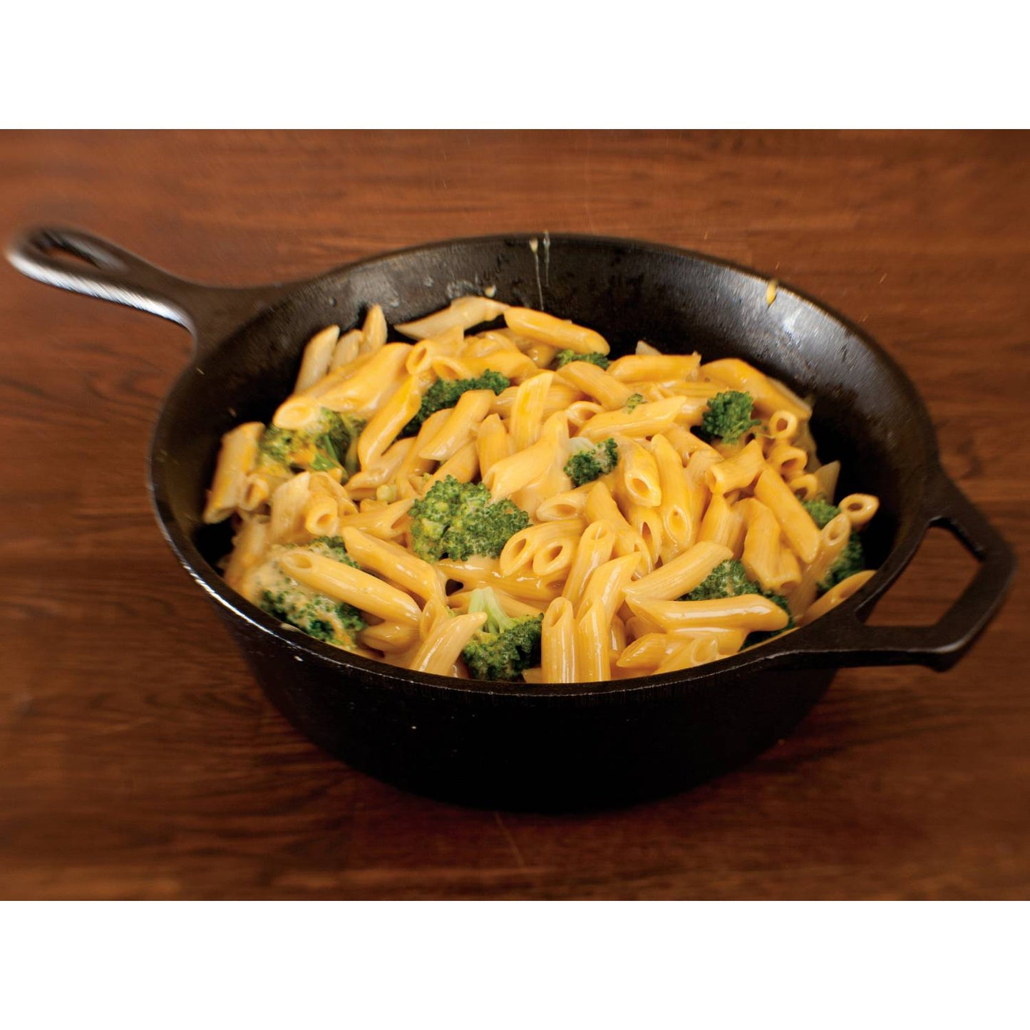 Black cast iron deep skillet filled with macaroni and cheese with broccoli in Kitchenware and Lodge Cast Iron collections