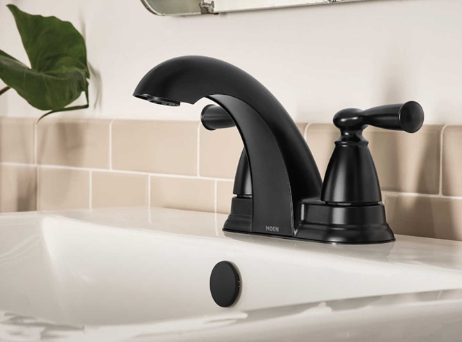 Matte black two-handle bathroom faucet with low arc spout featuring modern design for home improvement use