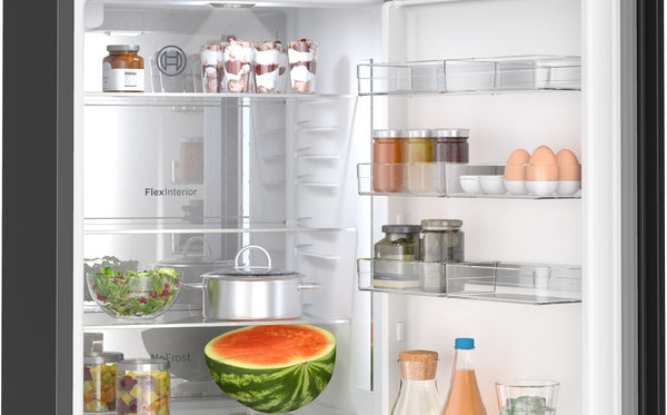 Open black Bosch fridge with glass door showing organized fresh food and beverages in bottom freezer refrigerators collection