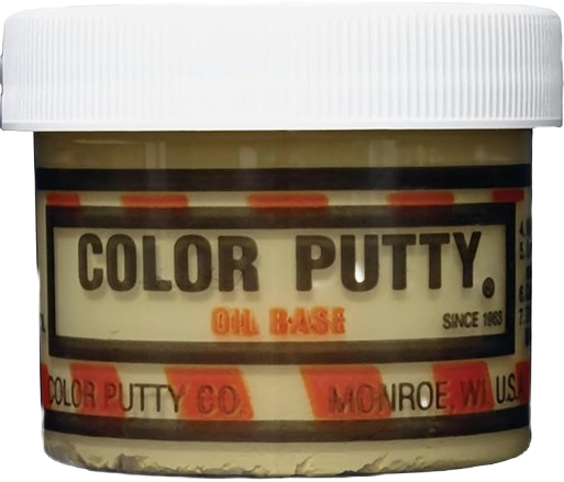 Small jar of natural oil base wood filler putty for patching and repair in woodworking and home improvement projects