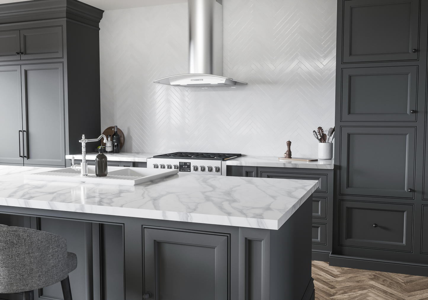Stainless steel chimney hood with curved canopy and LED lighting over gas cooktop in modern kitchen and cabinetry setting