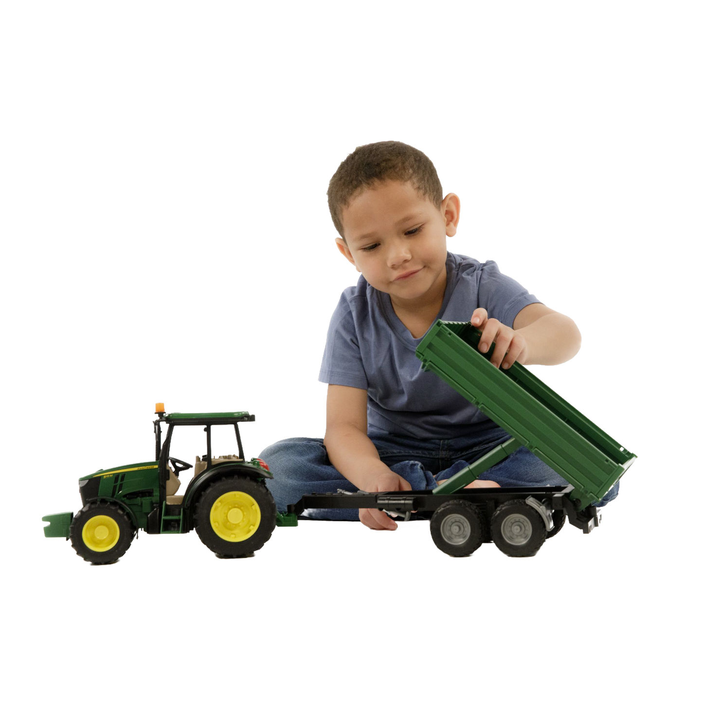 Child playing with Bruder John Deere 5115M toy tractor and green tipping trailer in Vehicles & Remote Controlled Toys collection