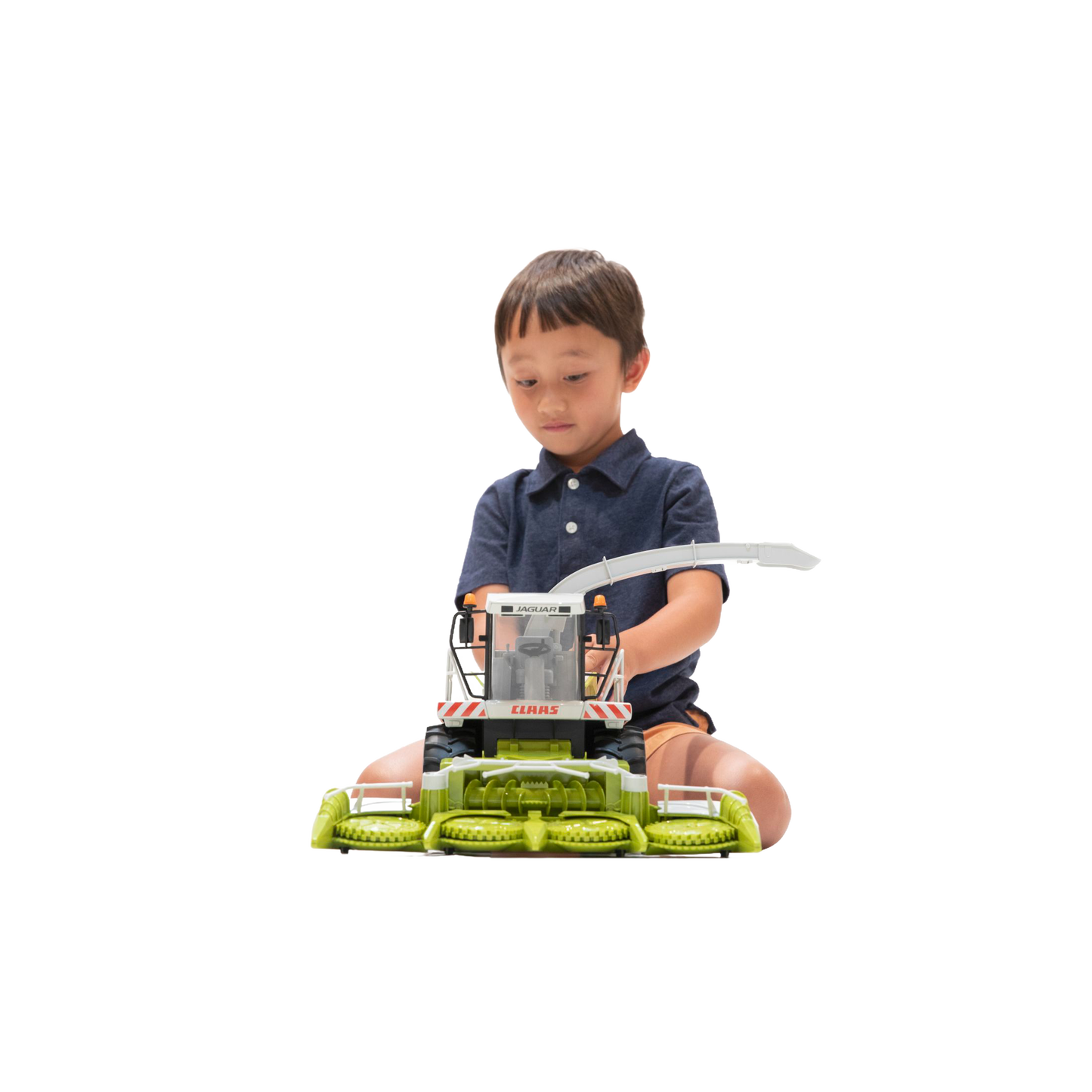 Child playing with a detailed Bruder Claas Jaguar 900 field chopper toy from Toys & Games and Bruder collections