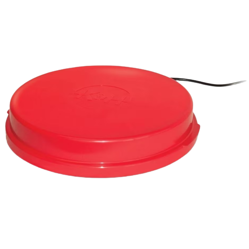 Round red heated poultry base with attached power cord designed for pet comfort and warmth indoors