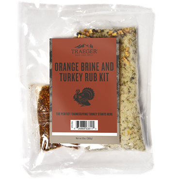 Clear plastic pouch containing orange brine and turkey rub seasoning for cooking and grilling