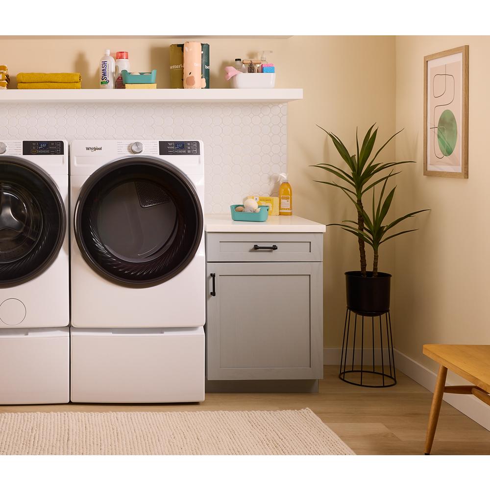 White smart front load gas dryer with digital display beside matching washer in modern laundry room setting from Appliances collection