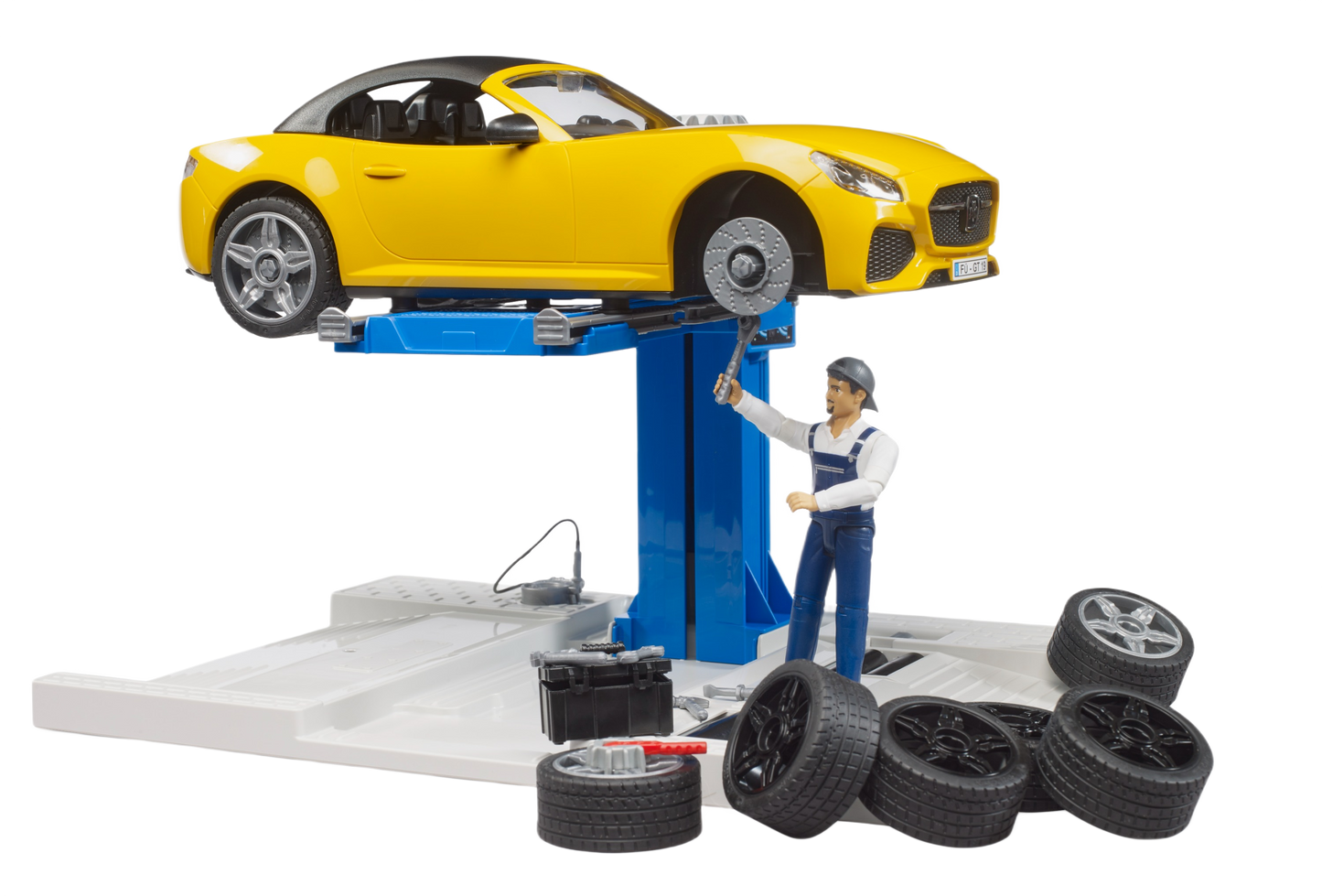 Yellow roadster toy elevated on blue car lift with mechanic figure, spare tires, and tool kit in car service playset