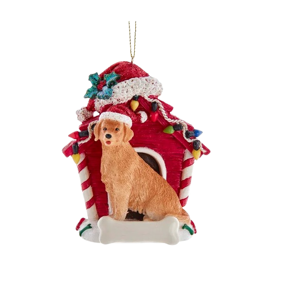 Golden retriever figurine wearing Santa hat sitting in front of red dog house decorated with Christmas lights and holly