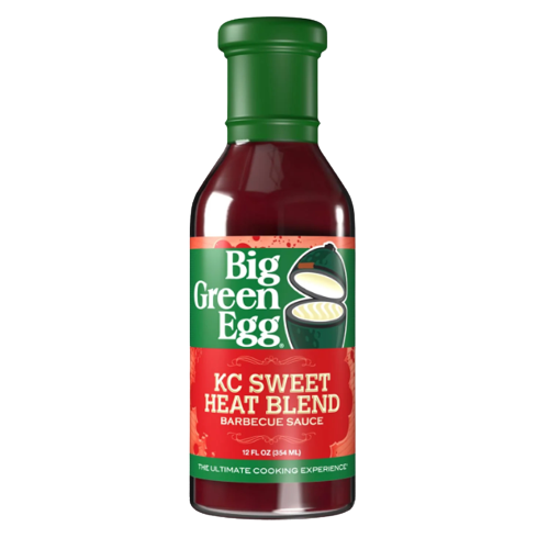 Bottle of Big Green Egg KC Sweet Heat Blend barbecue sauce with green cap and red label