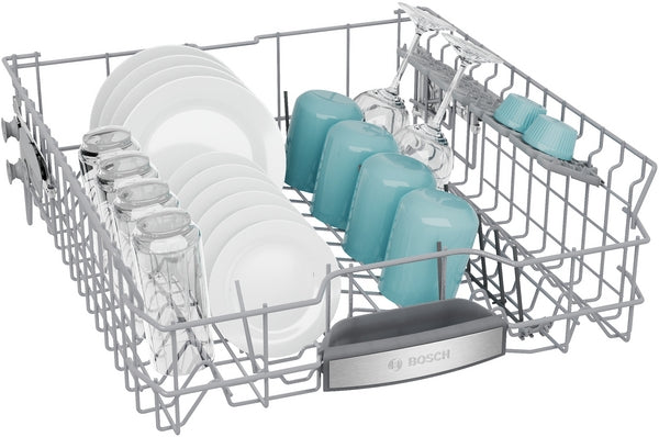 Top dishwasher rack filled with plates, glasses, and mugs in Bosch kitchen appliances collection