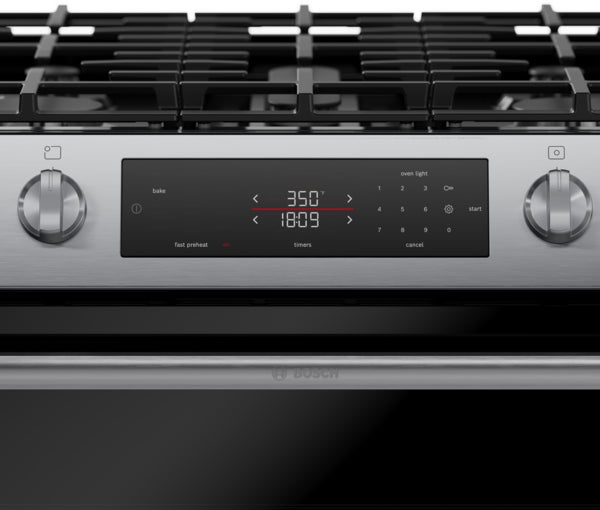 Close-up of stainless steel gas range control panel showing digital timer and temperature settings from Bosch Ranges collection