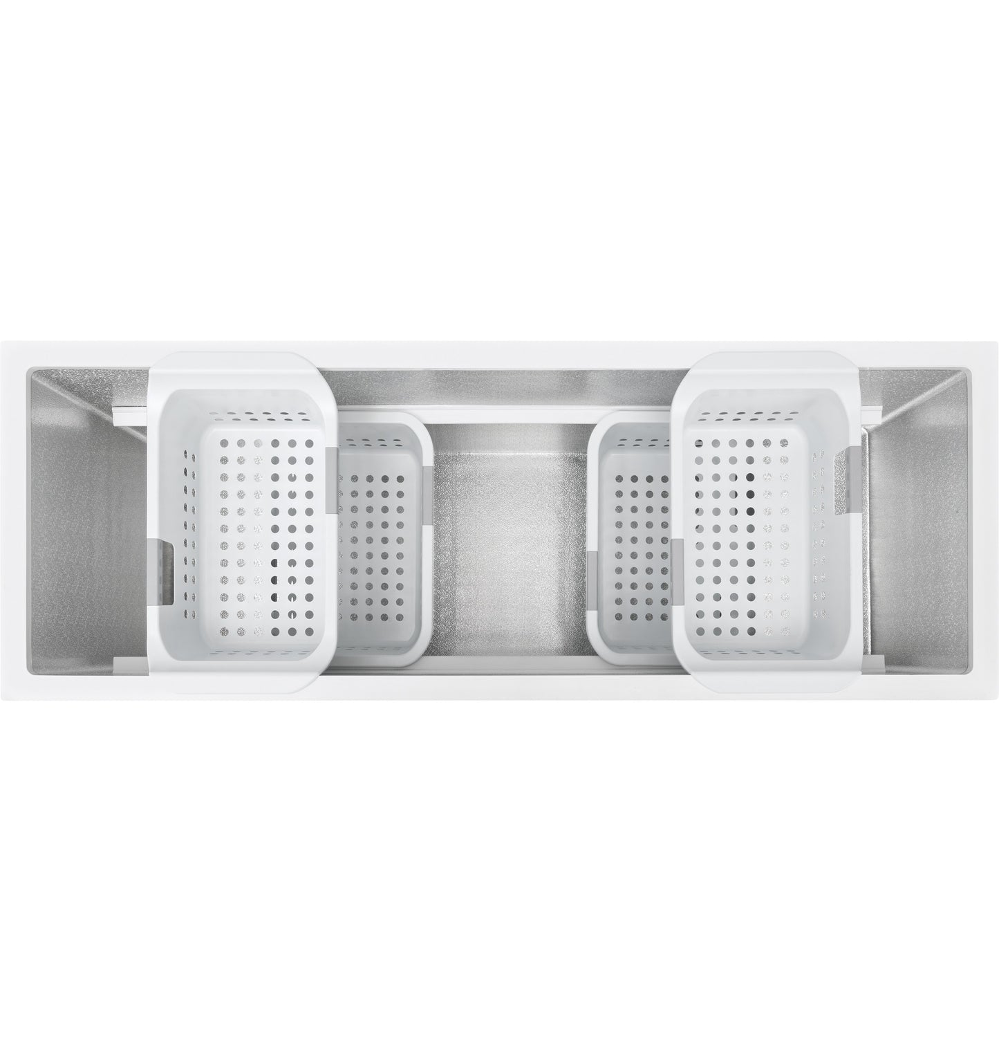Top view of empty manual defrost chest freezer interior with four removable white storage baskets for organization.
