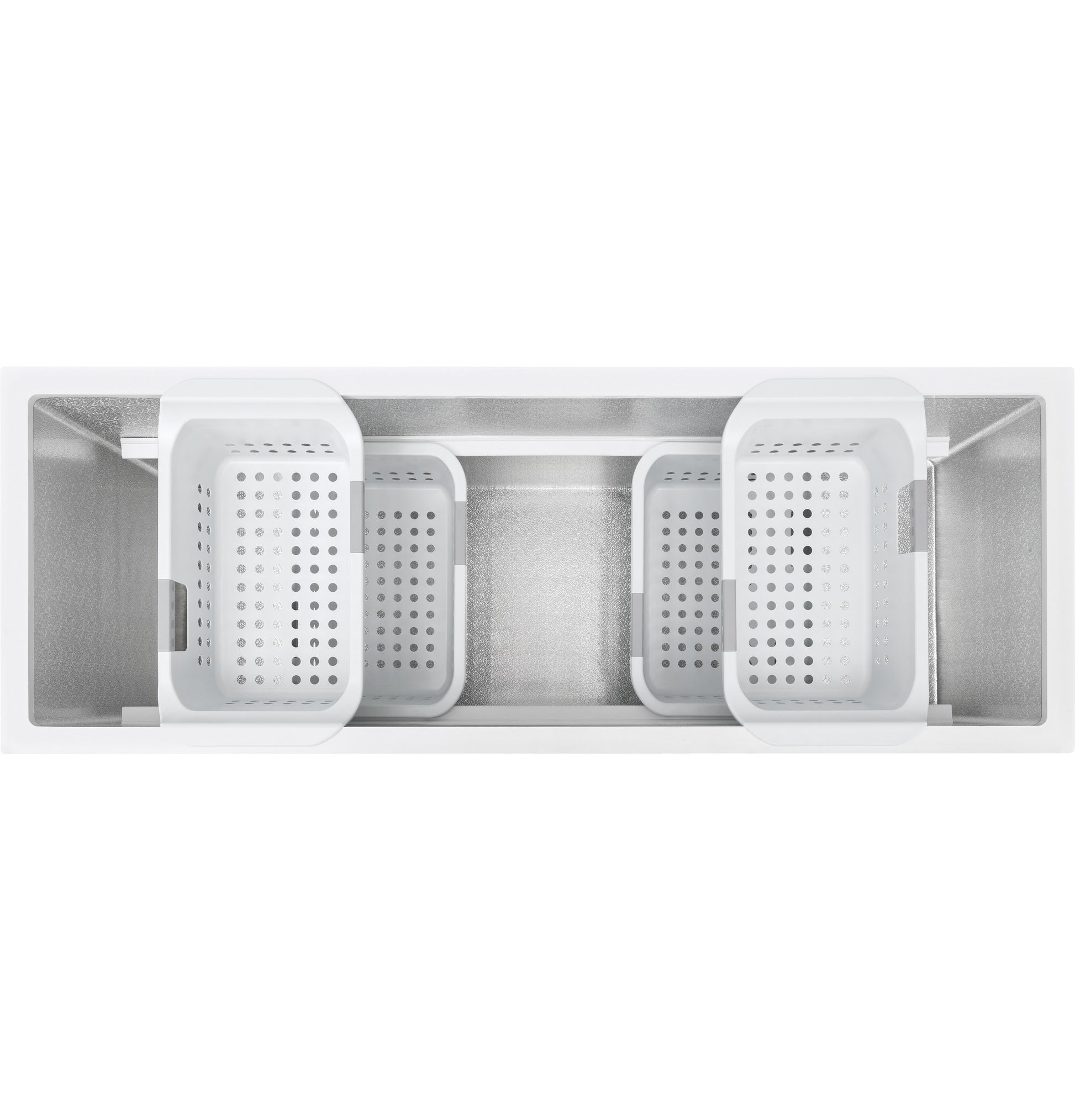 Top view of empty manual defrost chest freezer interior with four removable white storage baskets for organization.