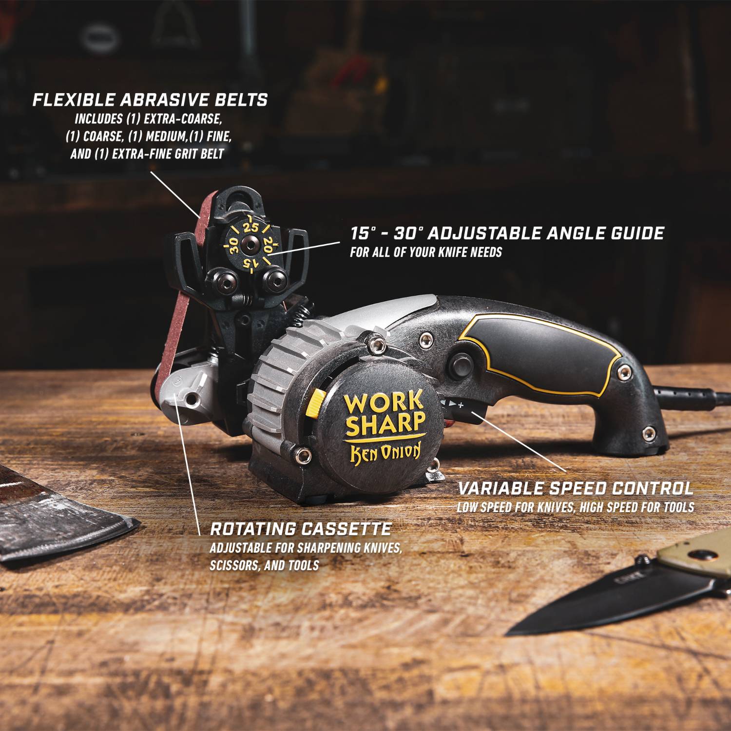 Work Sharp Ken Onion sharpener with adjustable angle guide, variable speed, and flexible abrasive belts on wooden surface