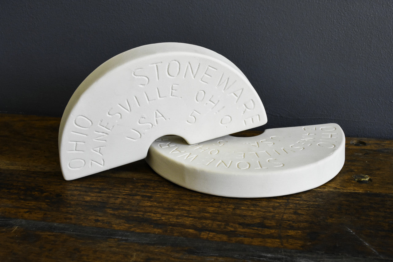 White ceramic two-piece weight stones embossed with Ohio Zanesville lettering for kitchenware under $50 collections