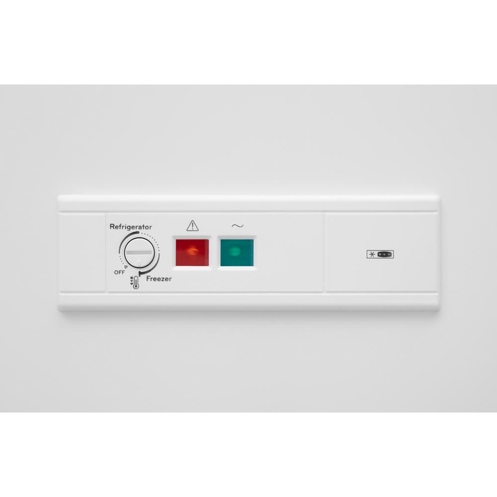 Control panel with temperature dial and indicator lights for freezer and refrigerator modes in Appliances collection