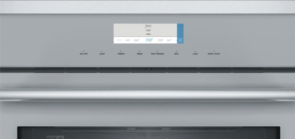 Close-up of stainless steel wall oven control panel with digital temperature display and multiple cooking mode options