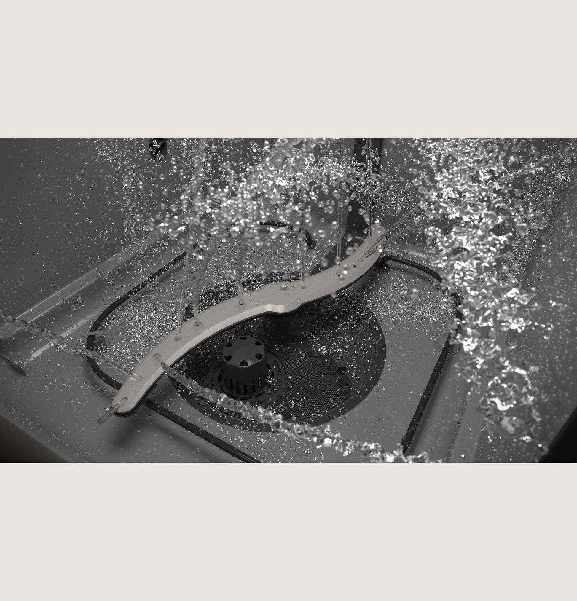 Water spraying inside the interior of a GE ENERGY STAR dishwasher from the Kitchen & Kitchenware appliances collection