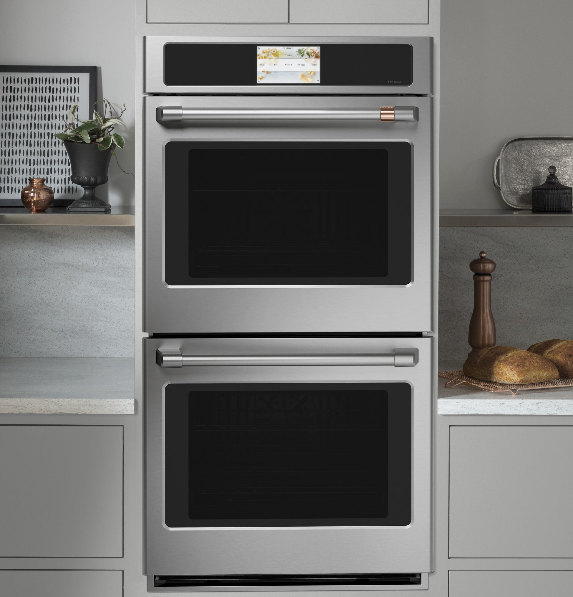 Built-in stainless steel double wall oven with convection and touchscreen control in kitchen appliance collection