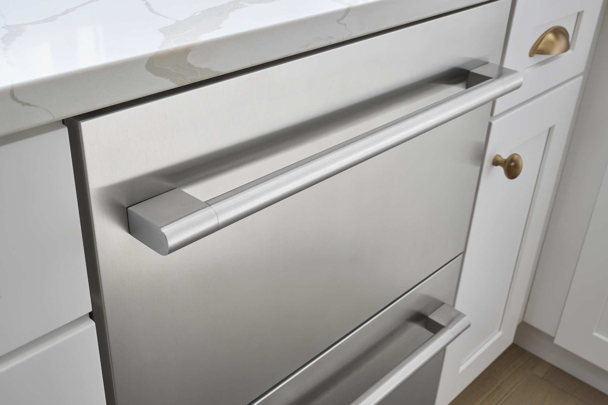 Built-in stainless steel dual drawer refrigeration unit with horizontal bar handles, installed in modern white cabinetry, part of Refrigerators, Mini Refrigerators, Kitchen & Kitchenware, and Appliances collections.