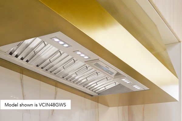 Built-in stainless steel custom insert hood with LED lighting and ventilation in modern kitchen setting
