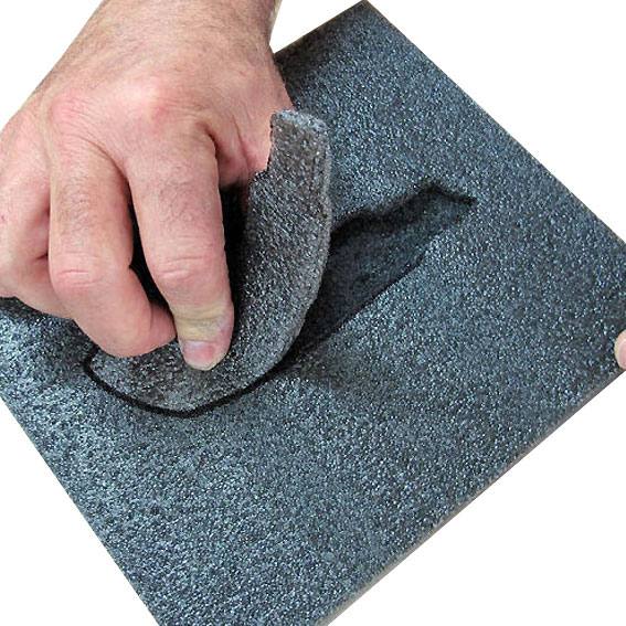 Hand pressing and shaping dense black foam sheet for custom tool storage and workshop organization under 50 dollars collection