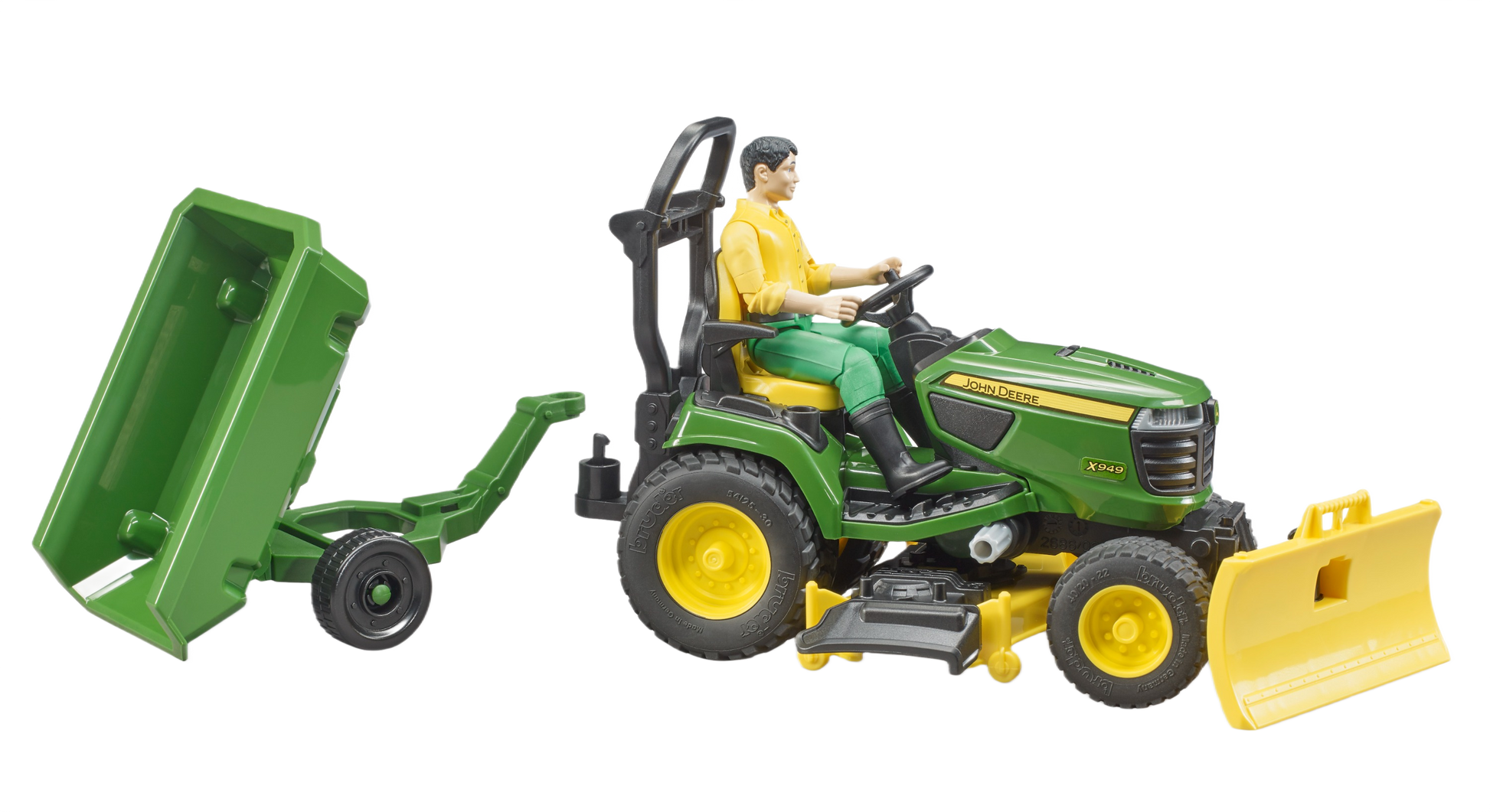 Green John Deere riding tractor toy with man figure, attached trailer, and front blade for outdoor power equipment collections