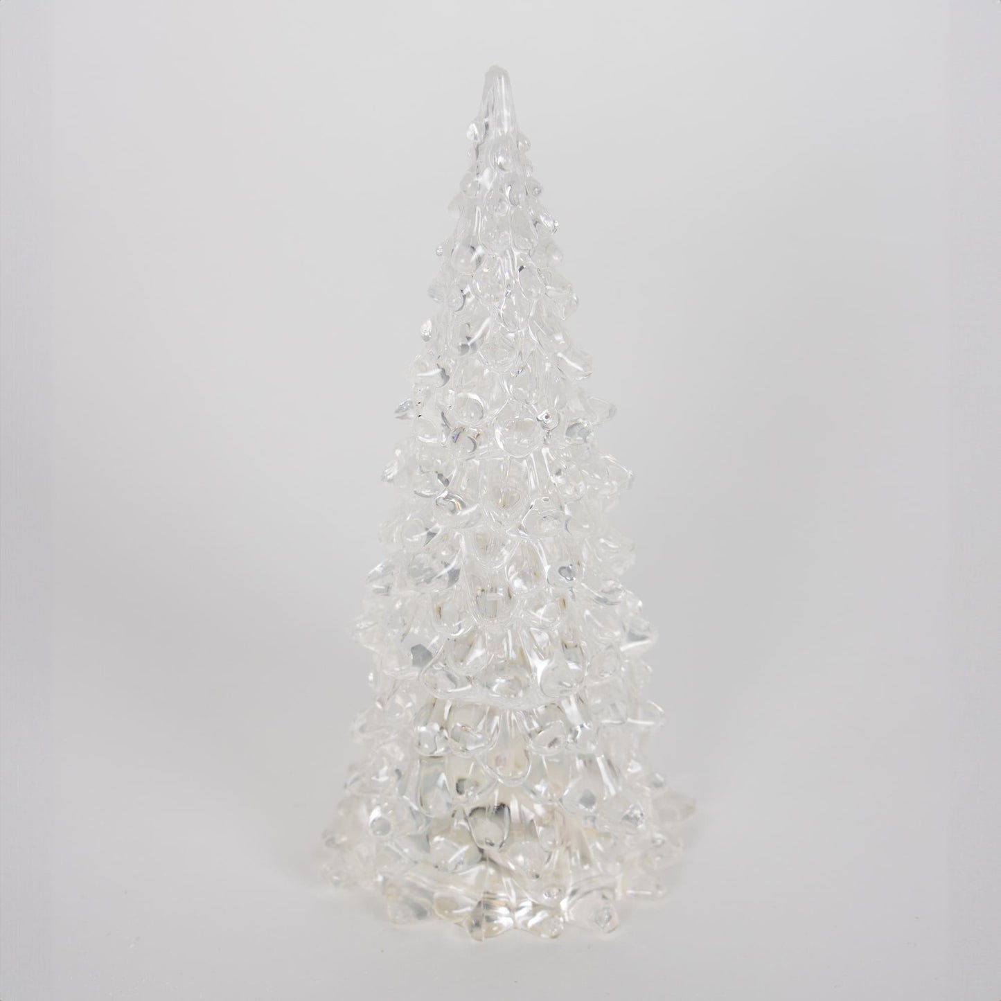 Single clear textured acrylic tree with embedded lights creating a delicate glowing effect for seasonal decor