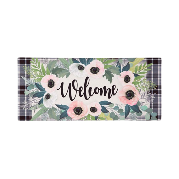 Floral welcome mat with pink and white flowers on a plaid background, durable polyester and rubber backing for outdoor use