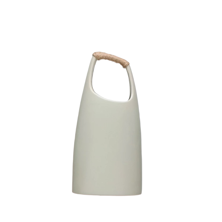 Tall ceramic vase with smooth matte finish and natural rattan wrapped handle for decorative use