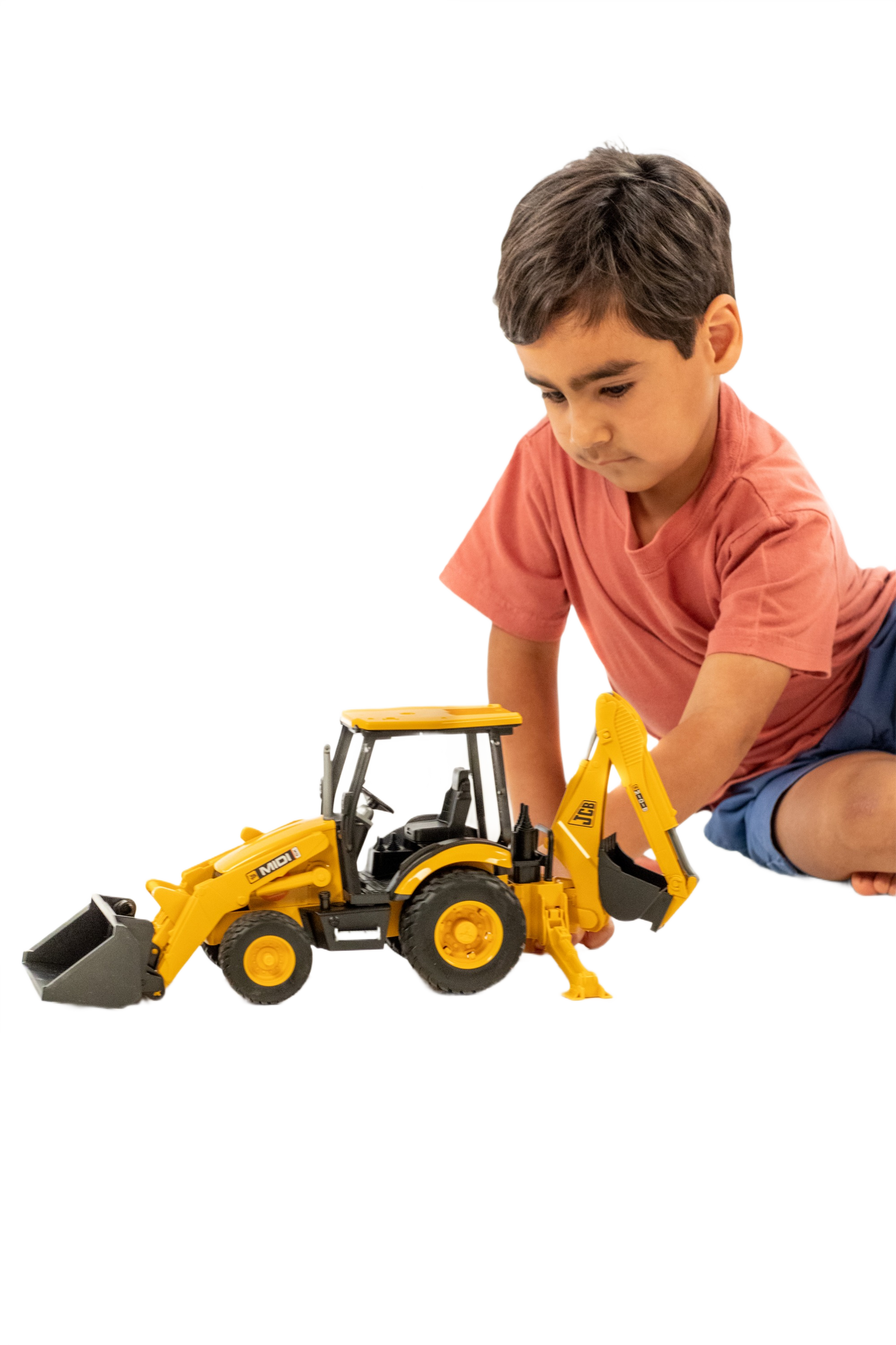 Child playing with yellow 1:16 scale backhoe loader toy from Bruder Toys in Vehicles & Remote Controlled Toys collection