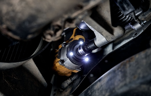 Compact cordless impact wrench with integrated LED lights for enhanced visibility in tight mechanical spaces