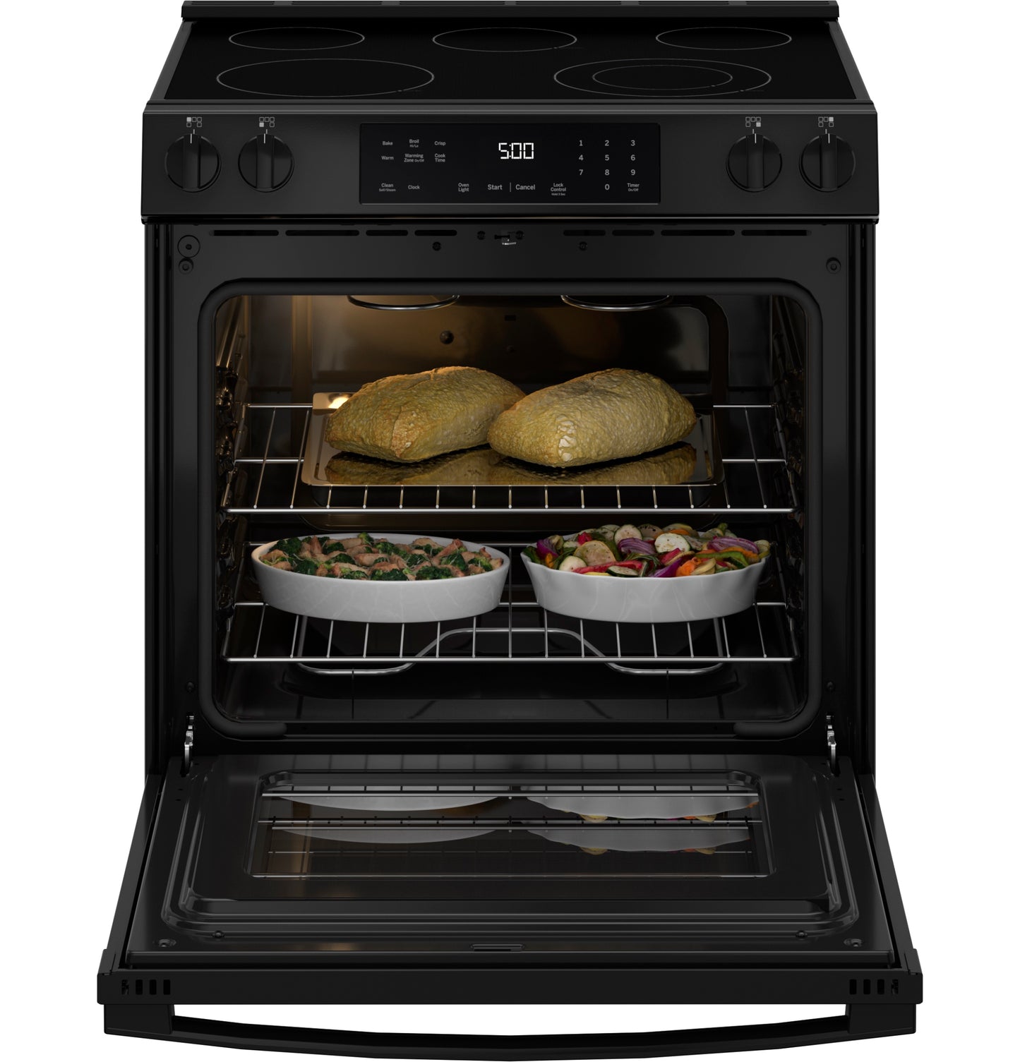 Black slide-in electric range with open oven cooking poultry and vegetables from Electric Ranges and Kitchen & Kitchenware collections