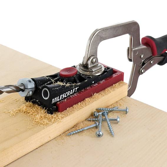 Milescraft PocketJig200 with drill bit and clamp creating precise pocket holes on wood in woodworking tool accessories collection